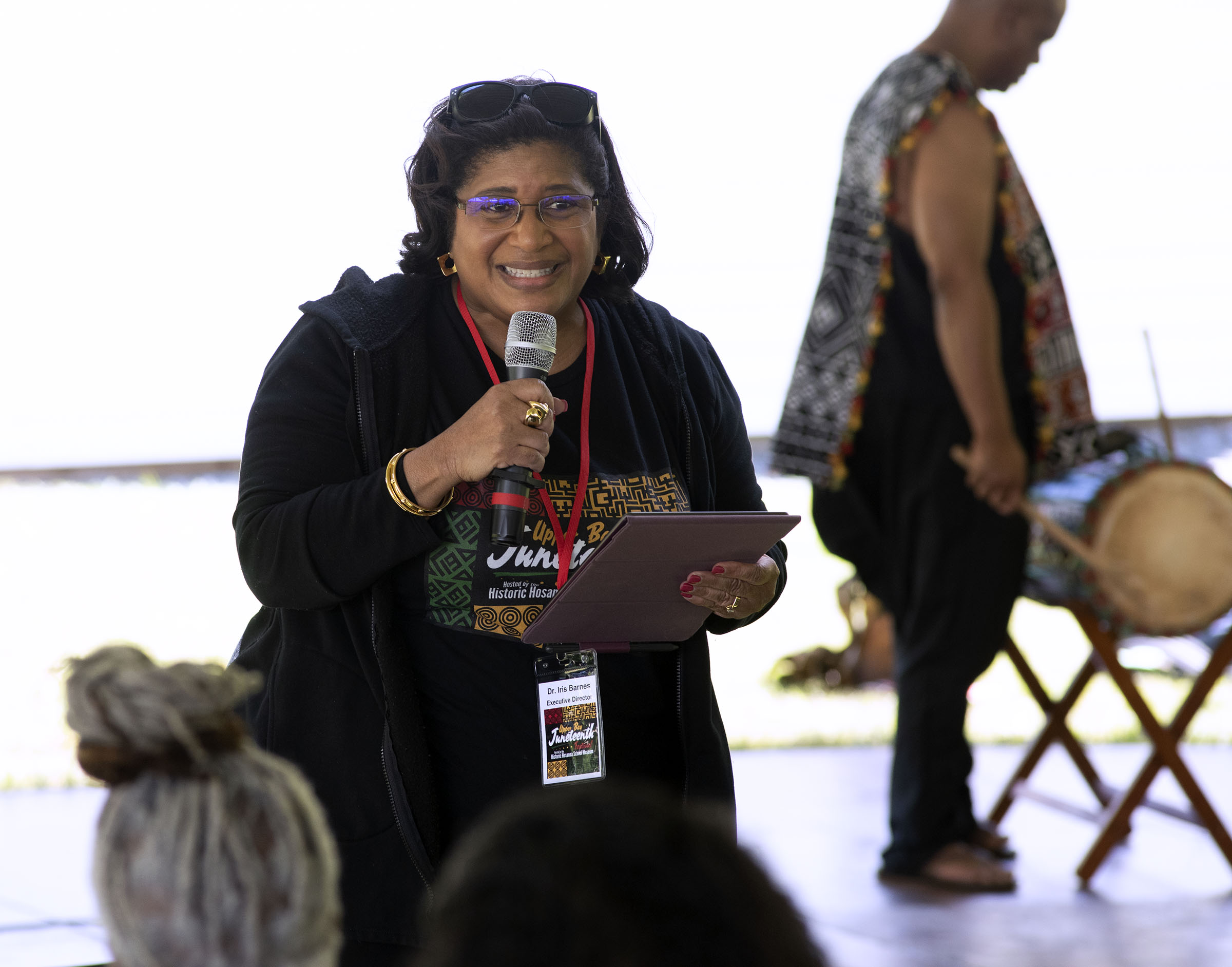 Dr. Iris Barnes, Executive Director of Hosana Community House, welcomes people to the 8th Annual Upper Bay Juneteenth Festival in Darlington. (John Gillis/Freelance)
