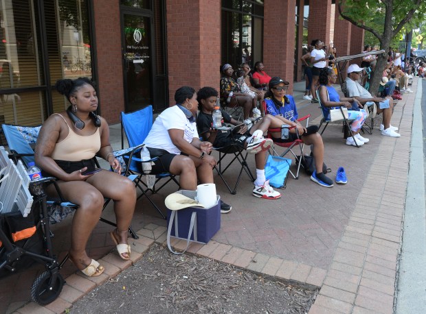 Parade goers watch the action. The Annapolis Juneteenth Parade makes its way up West Street Saturday afternoon. (Paul W. Gillespie/Staff photo)
