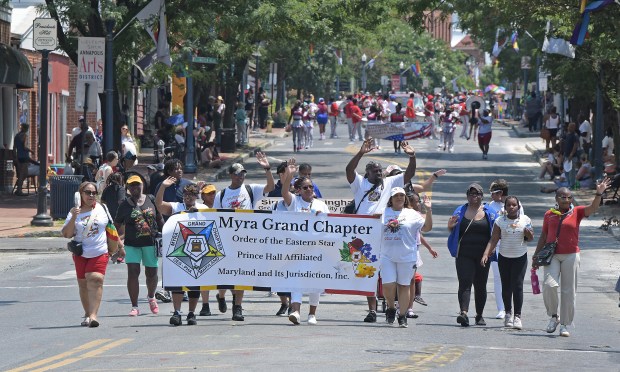 Myra Grand Chapter, Order of the Eastern Star, Prince Hall Affiliated, Maryland and its Jurisdiction, Inc. group marches. The Annapolis Juneteenth Parade makes its way up West Street Saturday afternoon. (Paul W. Gillespie/Staff photo)