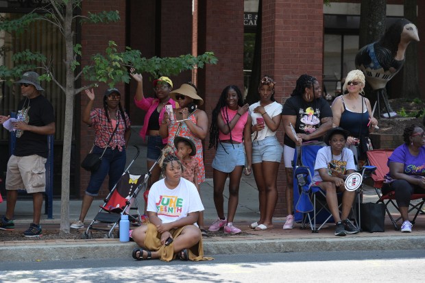 Parade goers watch the action. The Annapolis Juneteenth Parade makes its way up West Street Saturday afternoon. (Paul W. Gillespie/Staff photo)