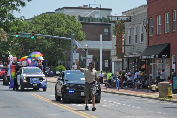 Anne Arundel County Sheriff Everett Sesker waves to the crowd as he marches in the parade. The Annapolis Juneteenth Parade makes its way up West Street Saturday afternoon. (Paul W. Gillespie/Staff photo)