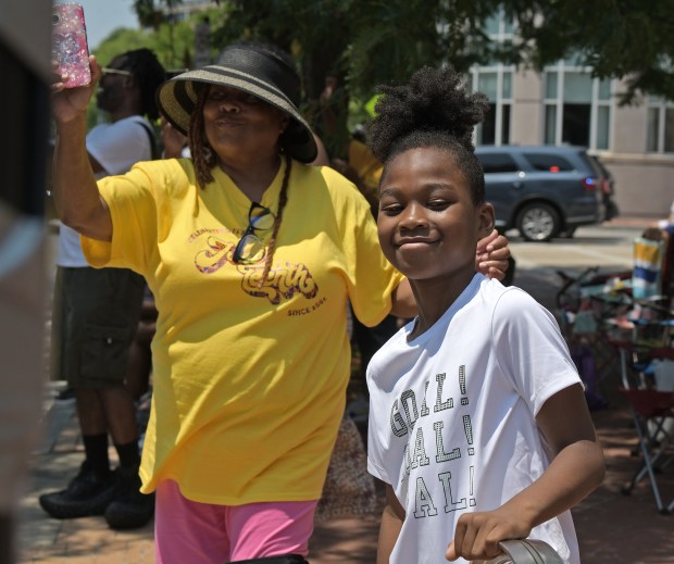 Zasere Wallace, 8, watches the parade. The Annapolis Juneteenth Parade makes its way up West Street Saturday afternoon. (Paul W. Gillespie/Staff photo)