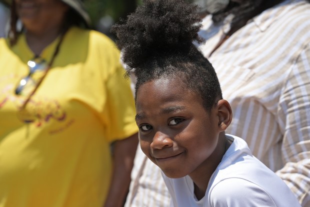 Zasere Wallace, 8, watches the parade. The Annapolis Juneteenth Parade makes its way up West Street Saturday afternoon. (Paul W. Gillespie/Staff photo)