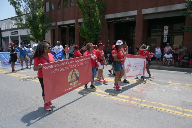 The Delta Sigma Theta Sorority marches by. The Annapolis Juneteenth Parade makes its way up West Street Saturday afternoon. (Paul W. Gillespie/Staff photo)