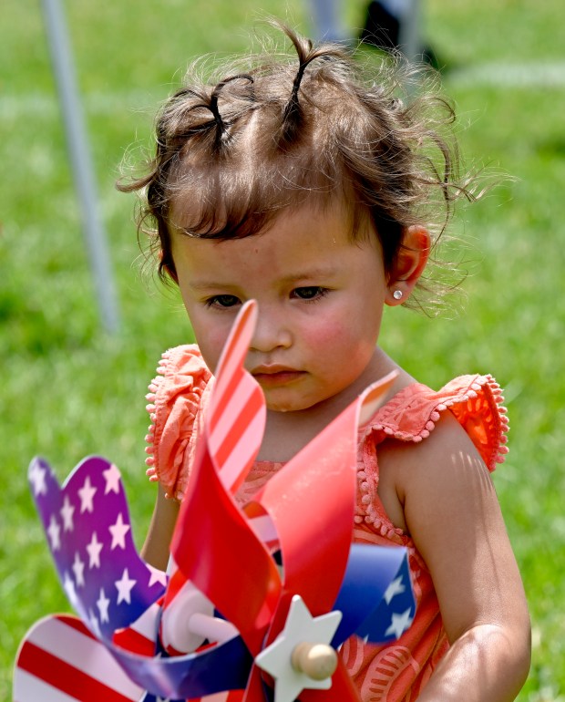 Natalie Reyes enjoys spinning the pinwheels on June 22, 2024.The...