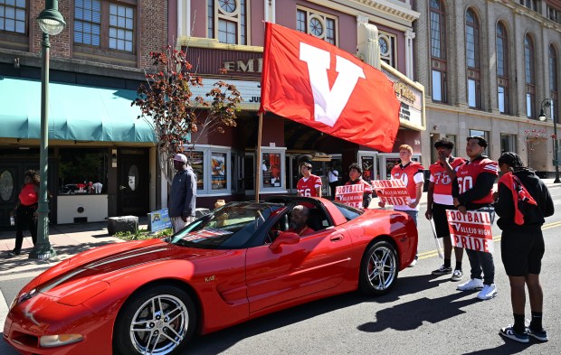 Members of the Vallejo High School football team pass in front of the Empress Theatre during the Vallejo Juneteenth parade on Virginia Street on Saturday. (Chris Riley/Times-Herald)