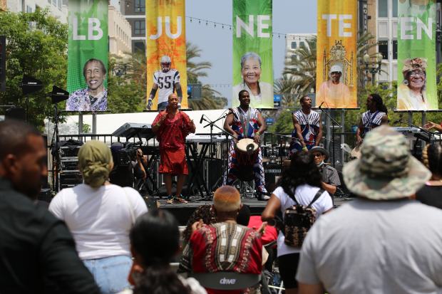 Spectators watch a performance by Le Ballet Dembaya at the...