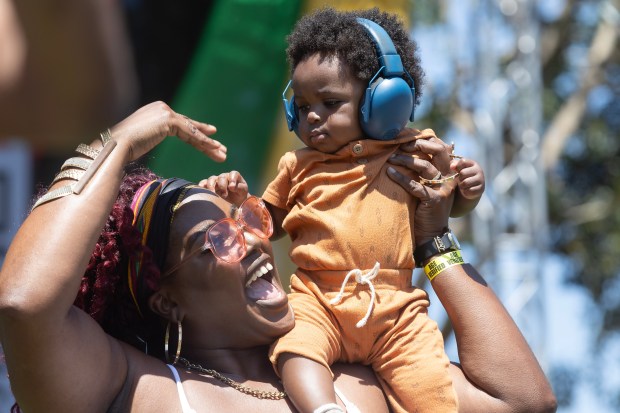 Queen Yaa and nine-month-old Sirius Joy dance during Long Beach’s...