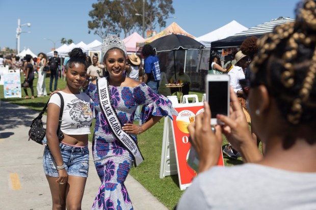 From left Amani Kingstro poses for a photograph with Miss...