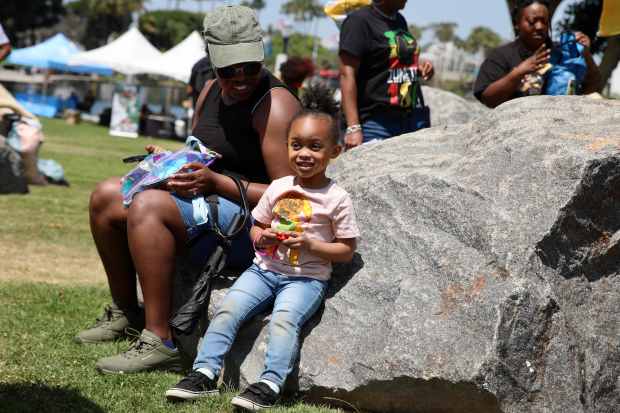 A family sits near the stage at the 3rd annual...