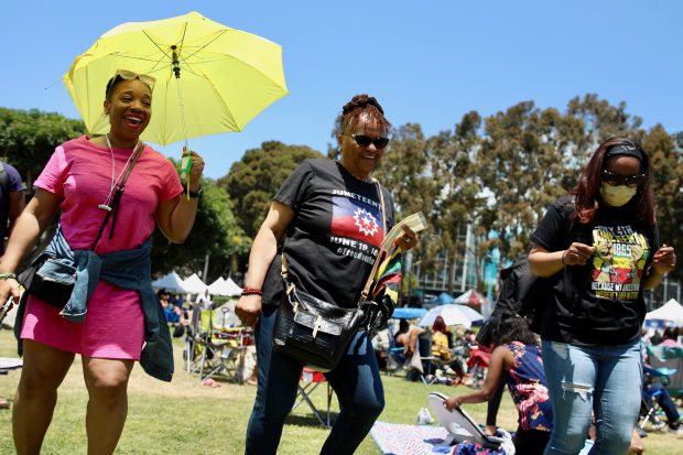 Attendees dance to the music at the 3rd annual Juneteenth...