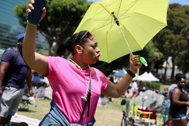 Gloria Casimir, visiting from New York City, dances on a...