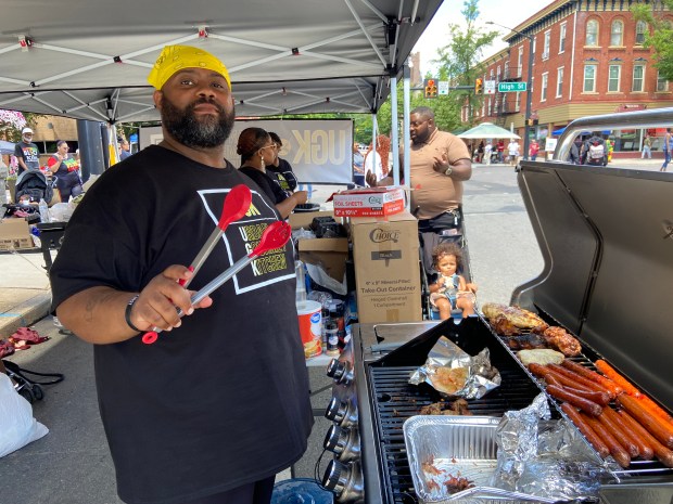 Fred Williams, owner of Urban Gourmet Kitchen, shows off one...