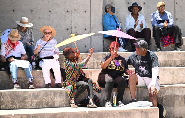 Audience members snack and snap photos while enjoying the music...