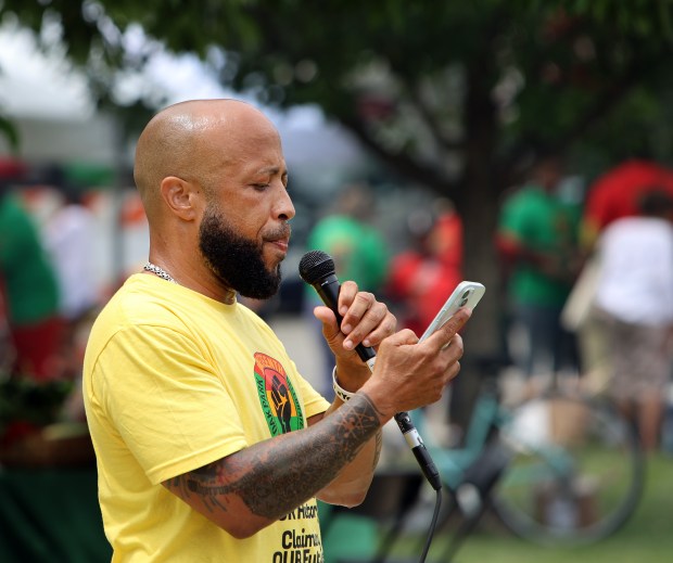 Chris Thomas reads a poem during Oak Park's Juneteenth community cookout held on the south lawn of Village Hall Saturday, June 15, 2024, in Oak Park. (James C. Svehla/for Pioneer Press)