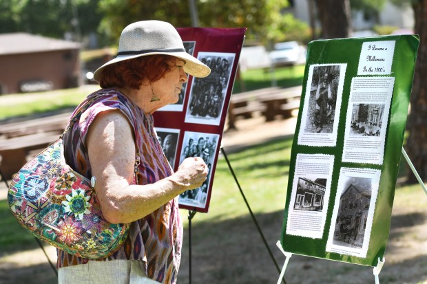 Martha Hone-Warren looks at history boards on SUnday, June 16,...