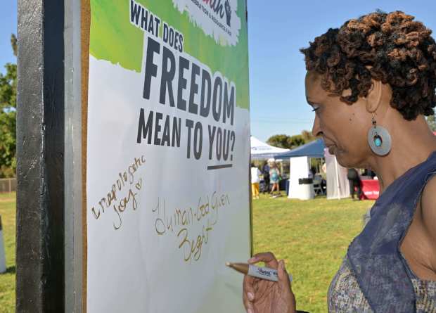 Petra King writes on the board that freedom to her...