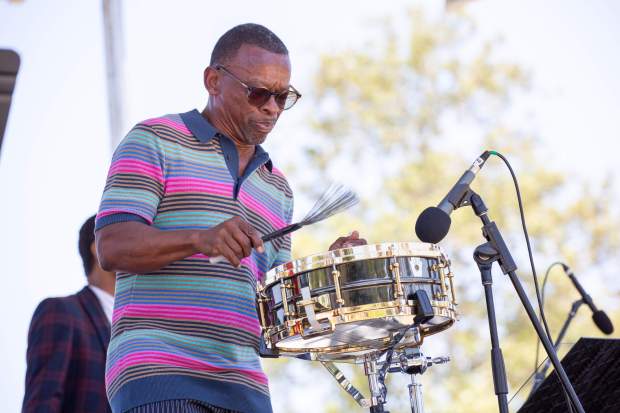 Drummer Clayton Cameron uses drum brushes as he performs during...