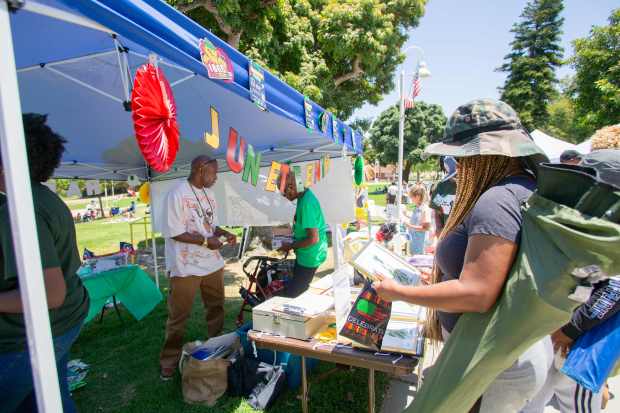 Booths hosted a variety of goods, including painted artworks, during...