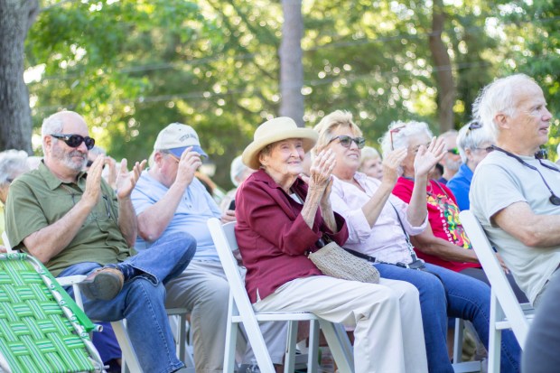 Audience members react to Tshombe Selby's singing at Juneteenth in...