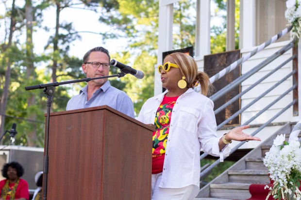 Manteo Mayor Pro Tem Betty Selby (right) gives brief remarks...