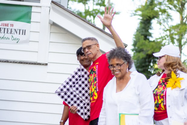 Darrell Collins (center), president of the nonprofit Pea Island Preservation...